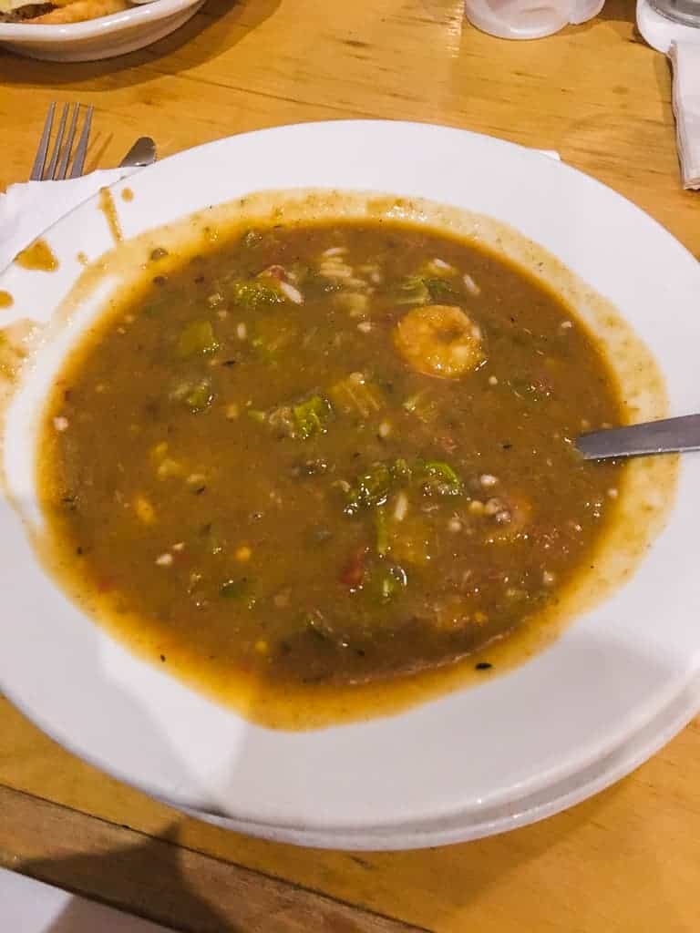 A white bowl filled with seafood gumbo.