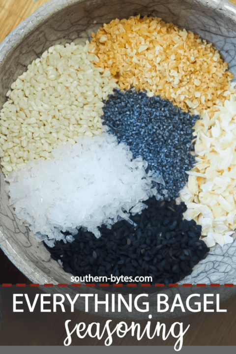 A pin image of a bowl of the unmixed ingredients in everything bagel seasoning.