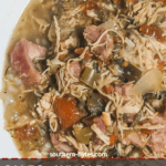 A pin image of a white bowl of paleo chicken and sausage gumb.