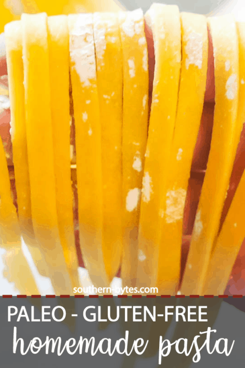 A pin image of a hand draped with homemade paleo fettuccine.
