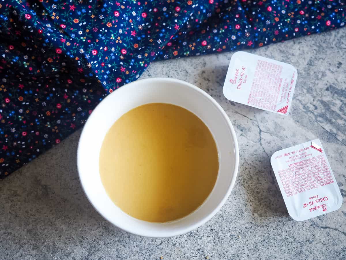 A small white bowl of copycat chick-fil-a sauce.