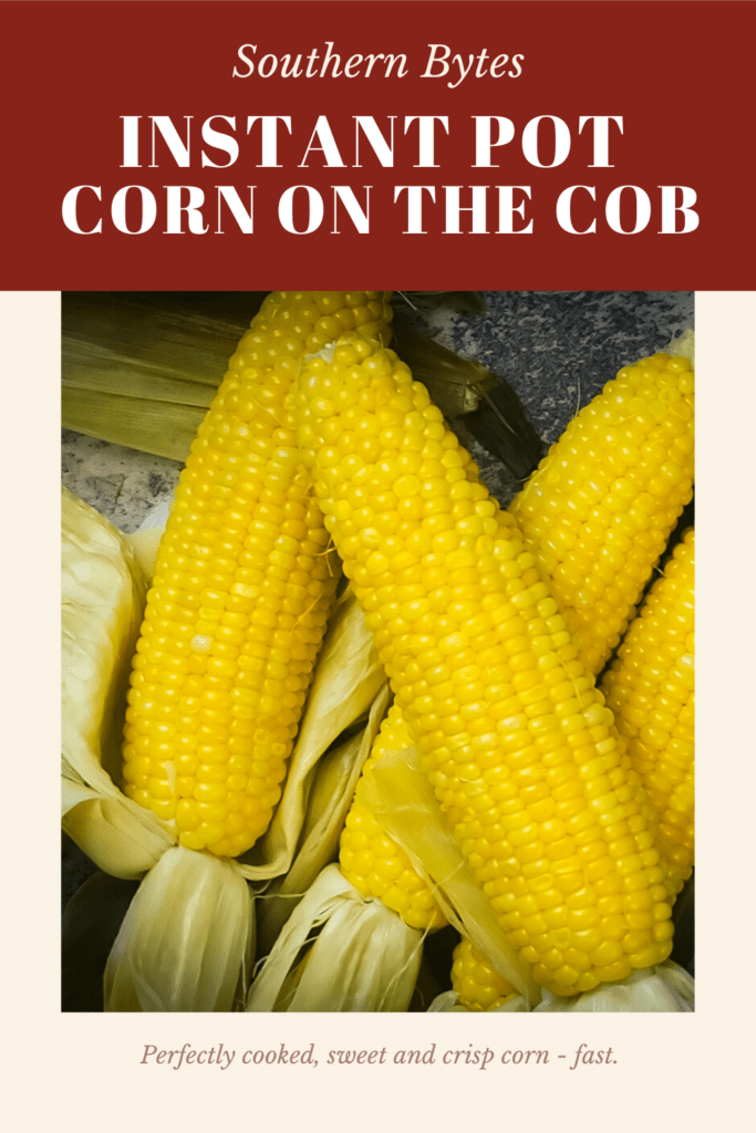 a pin image of four ears of corn with husks peeled back