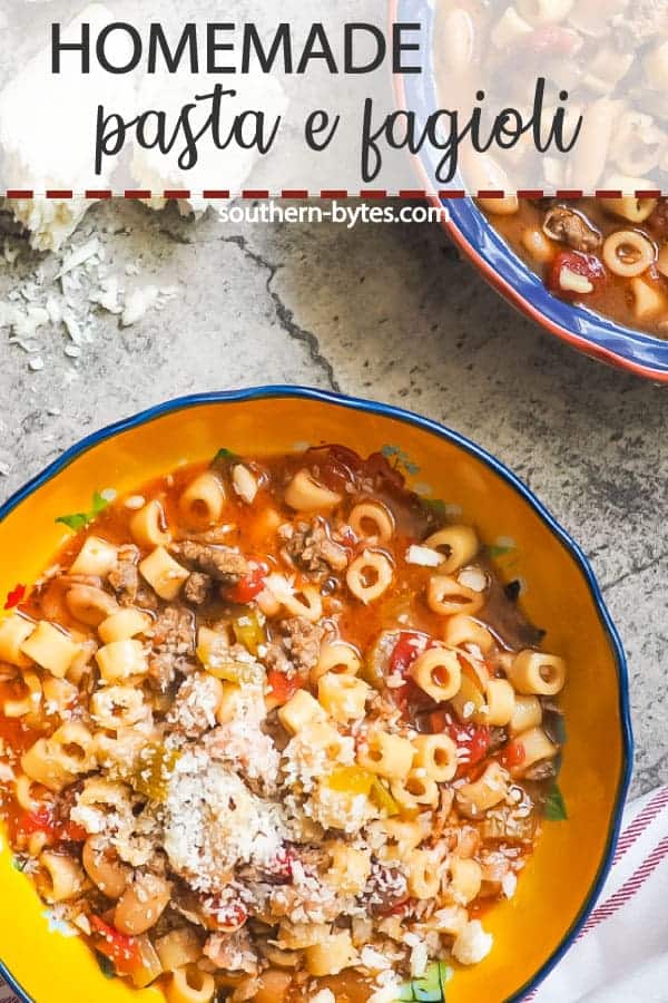 a pin image of a blue bowl of pasta e fagioli