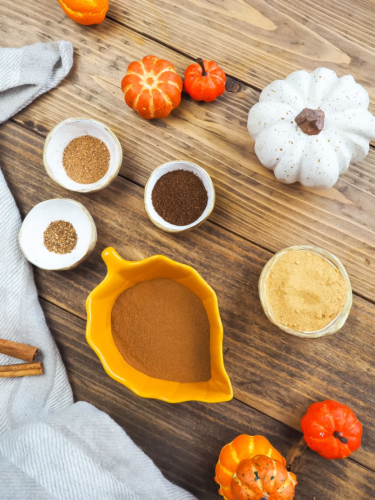 a picture of the ingredients in pumpkin pie spice in little bowls.