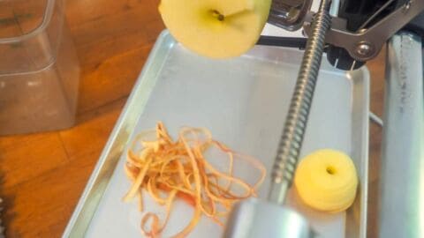 An apple slicer slicing an apple.