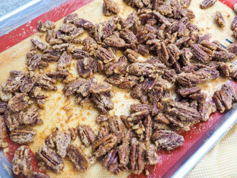 a zoomed in image of a tray of candied pecans.