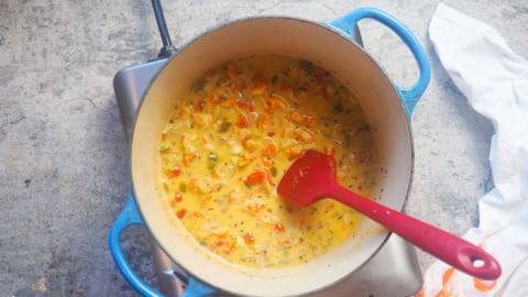 crawfish etouffee cooking in a blue pot