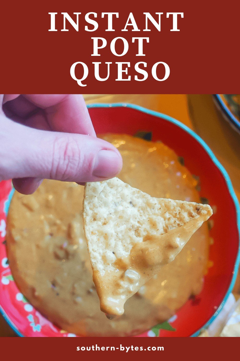 A pin image of a chip dipped in queso held over a red bowl.