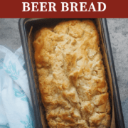A pin image of a loaf of beer bread in a metal loaf pan.