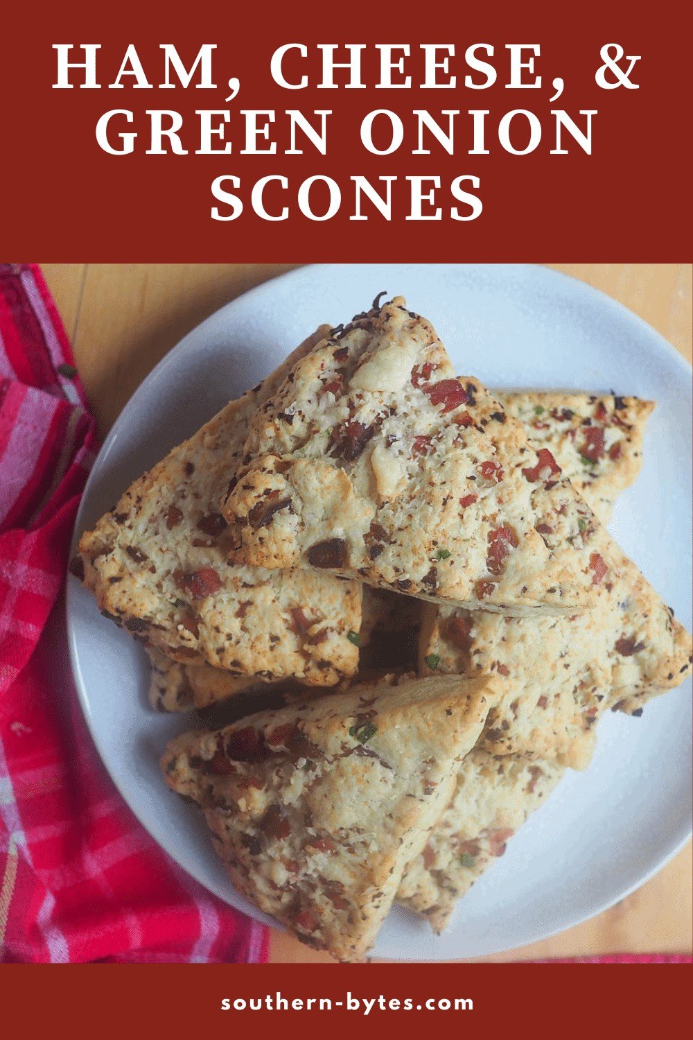 A pin image of a white plate of ham and cheese scones.