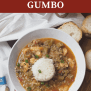 A pin image of a white bowl of seafood gumbo.