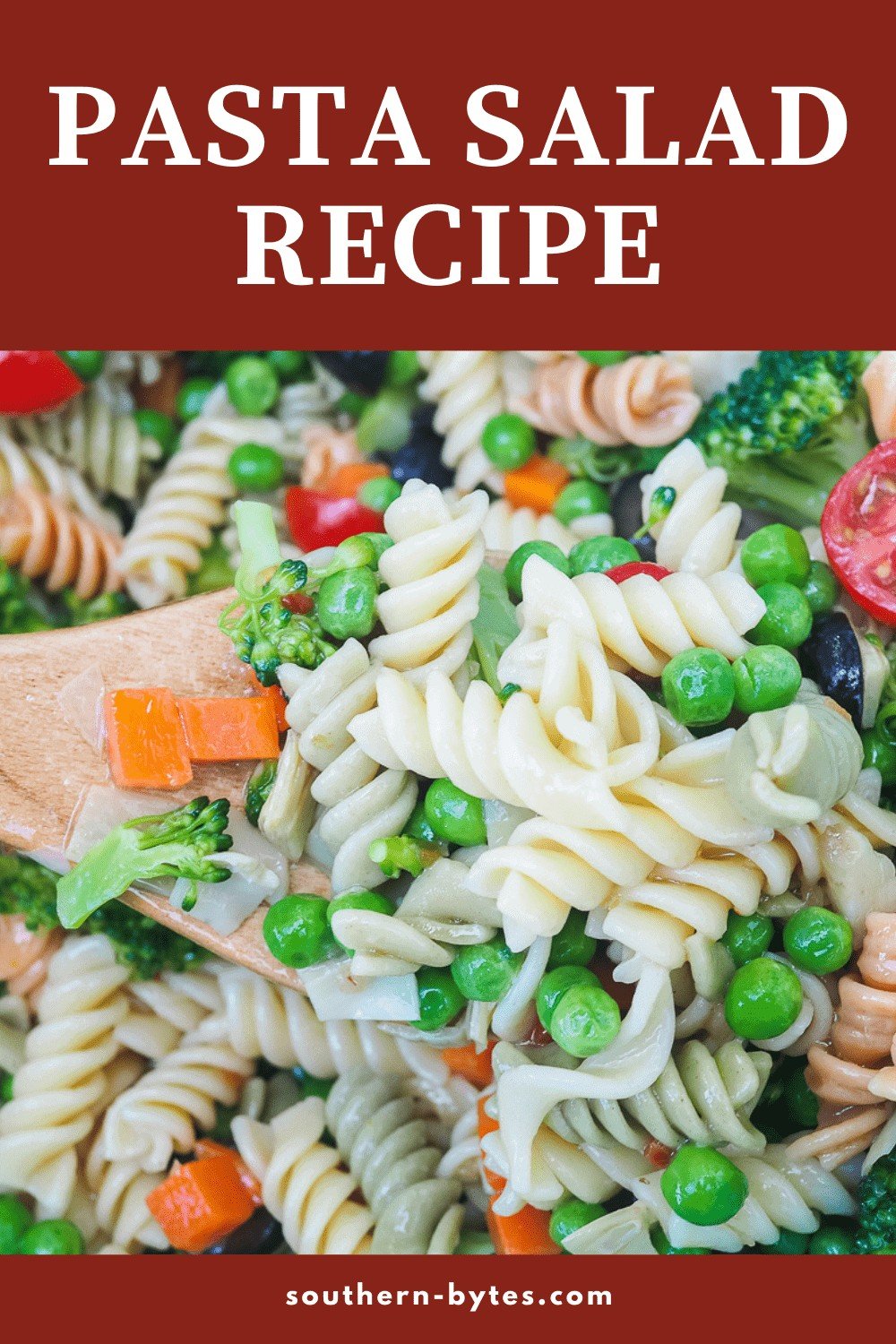 A pin image of a scoop of pasta salad on a wooden spoon.