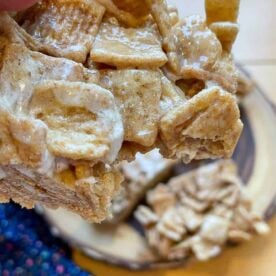 A Cinnamon Toast Crunch Cereal Treat with a bite taken out.