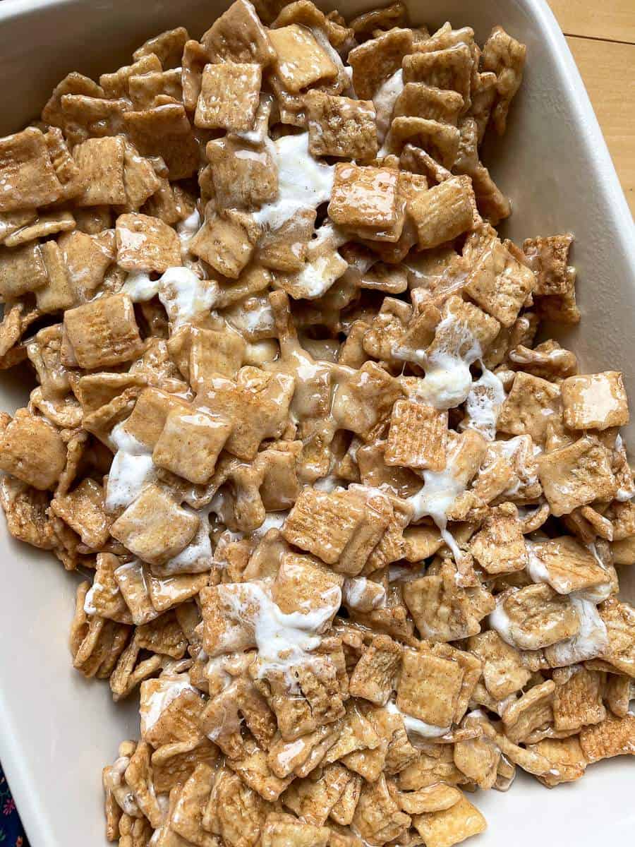 A close up of Cinnamon Toast Crunch Cereal Treats in a casserole pan.