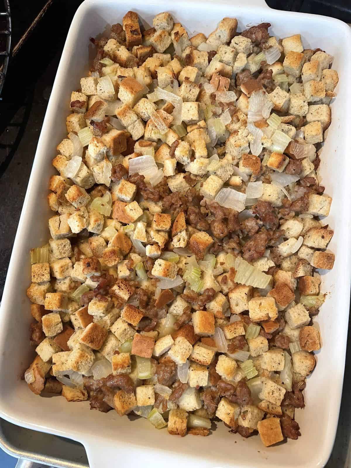 A white pan of cooked homemade stuffing.