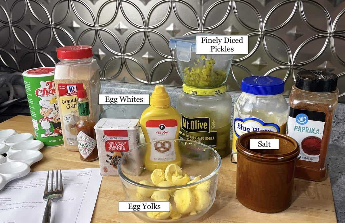 The ingredients in cajun deviled eggs laid out and labeled.