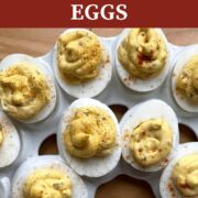 A pin image of two rows of cajun deviled eggs.