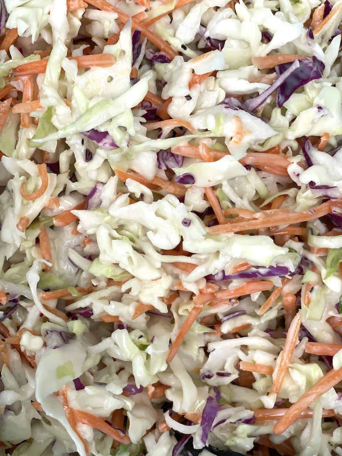 Raising Cane's Coleslaw (shredded carrots & cabbage covered in mayonnaise) up close.