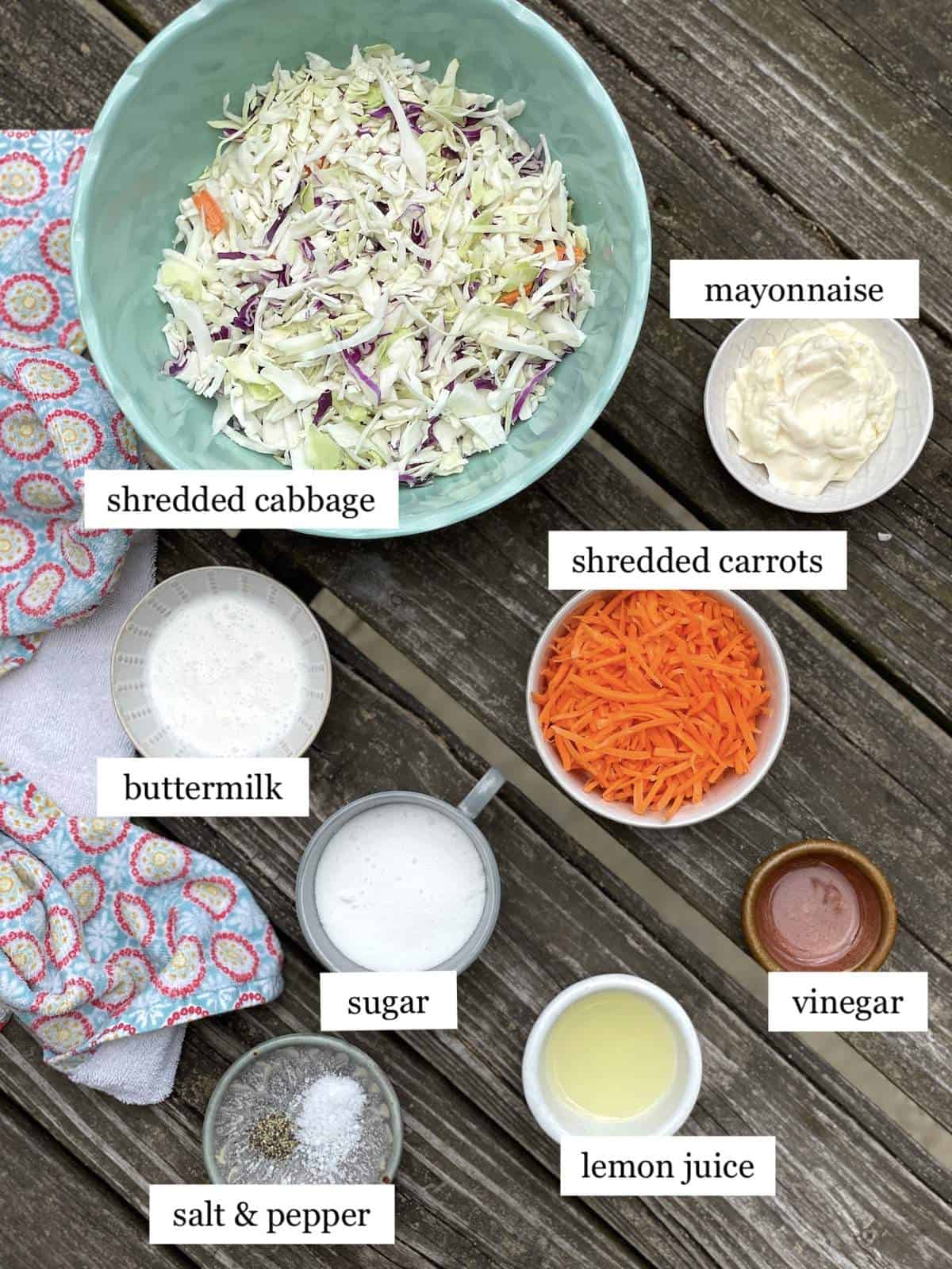 The ingredients in creamy southern coleslaw, laid out and labeled.