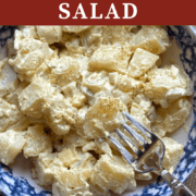 A pin image of a bowl of southern potato salad with celery and pickles.