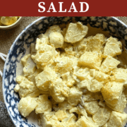 A pin image of a bowl of creamy southern potato salad with mustard based dressing.