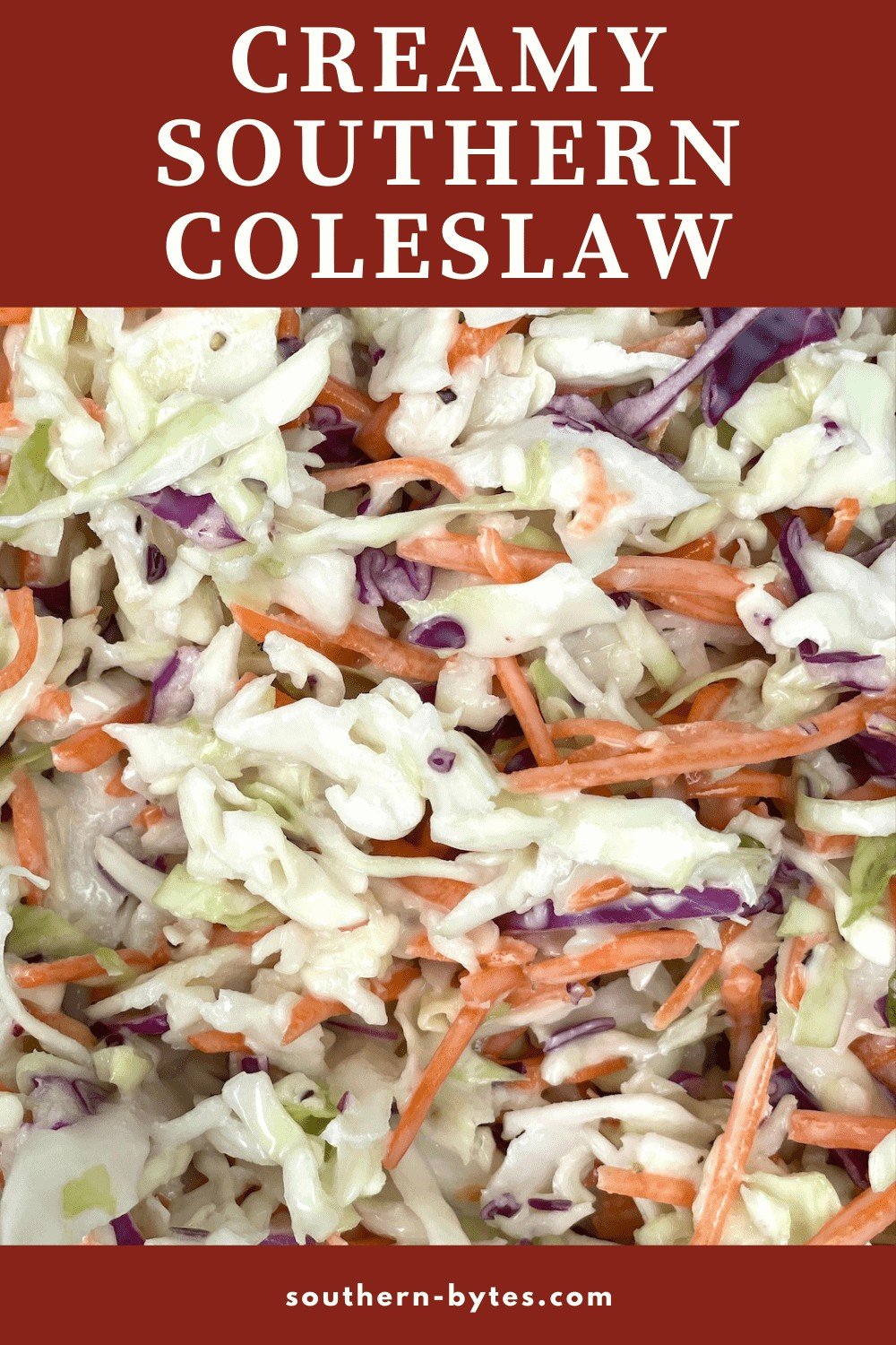 A pin image of creamy southern coleslaw (shredded carrots & cabbage covered in mayonnaise) up close.