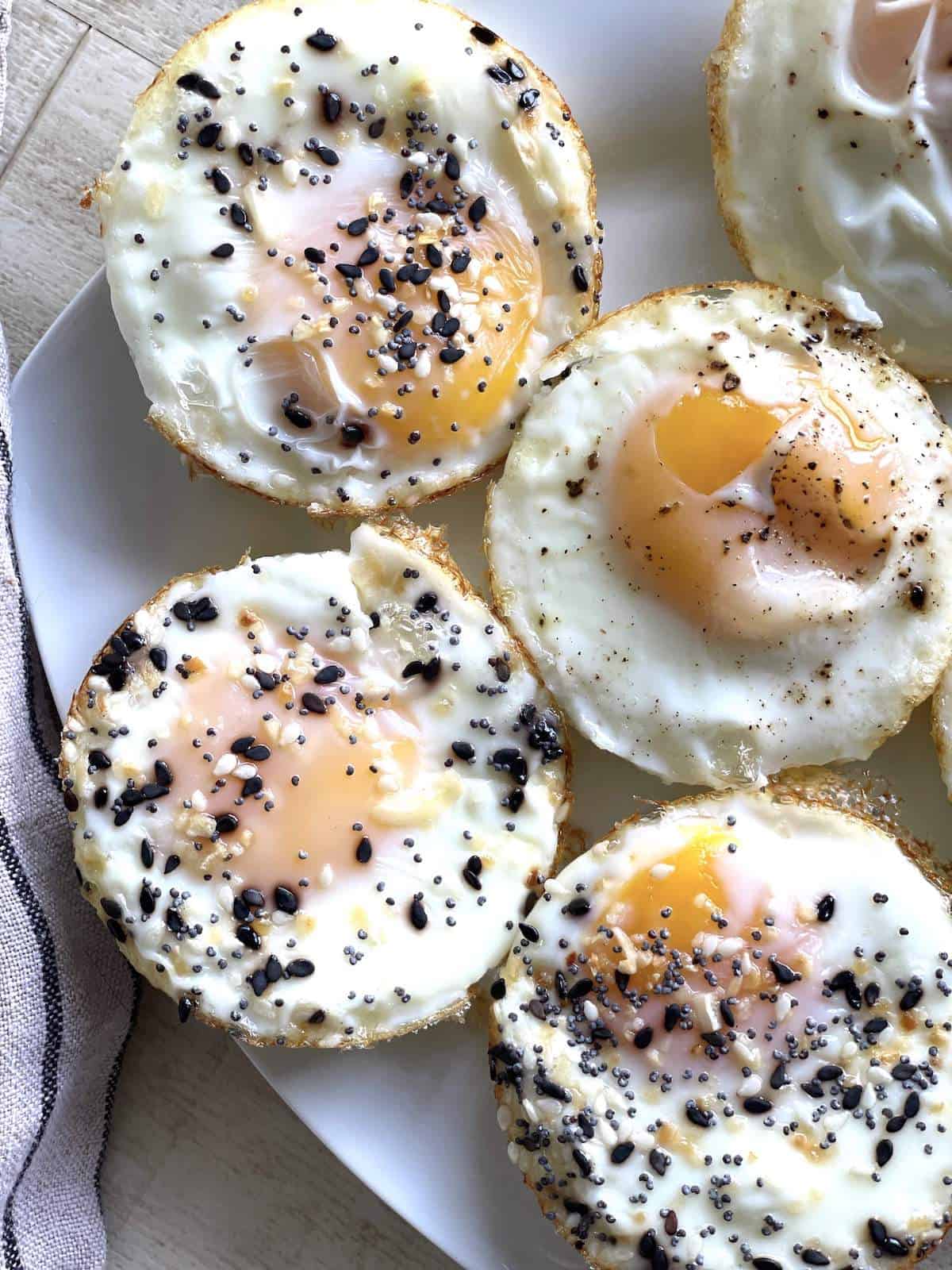 Muffin tin baked eggs on a white plate.