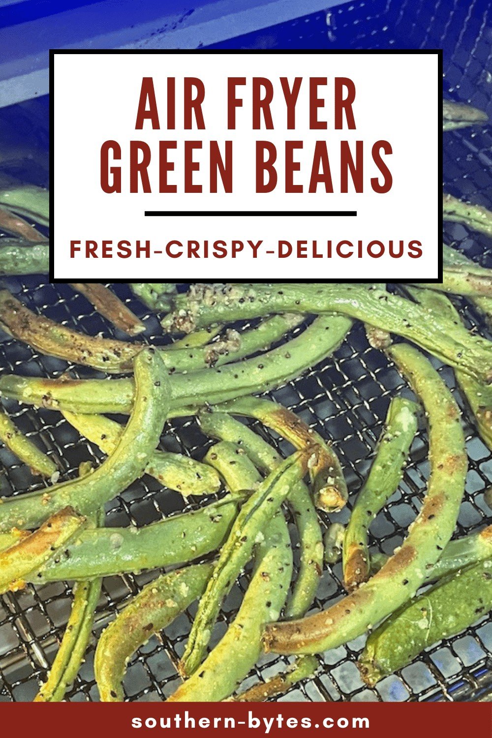 A pin image of air fried green beans in the basket of a toaster oven air fryer.