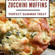 A pin image of a savory zucchini muffin with cheddar and jalapeños.
