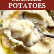 A pin image of a spoonful of buttermilk mashed potatoes over a bowl of mashed potatoes.