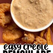 A pin image of creole remoulade sauce with fried shrimp.