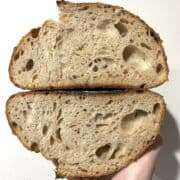 A sliced open loaf of sourdough bread.