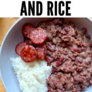 A pin image of a bowl of Louisiana red beans and rice with sliced andouille.
