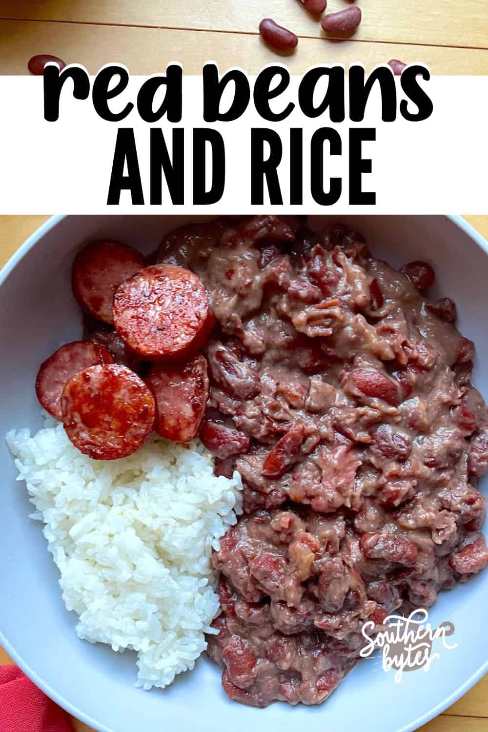 A pin image of a bowl of red beans and rice with sliced andouille.