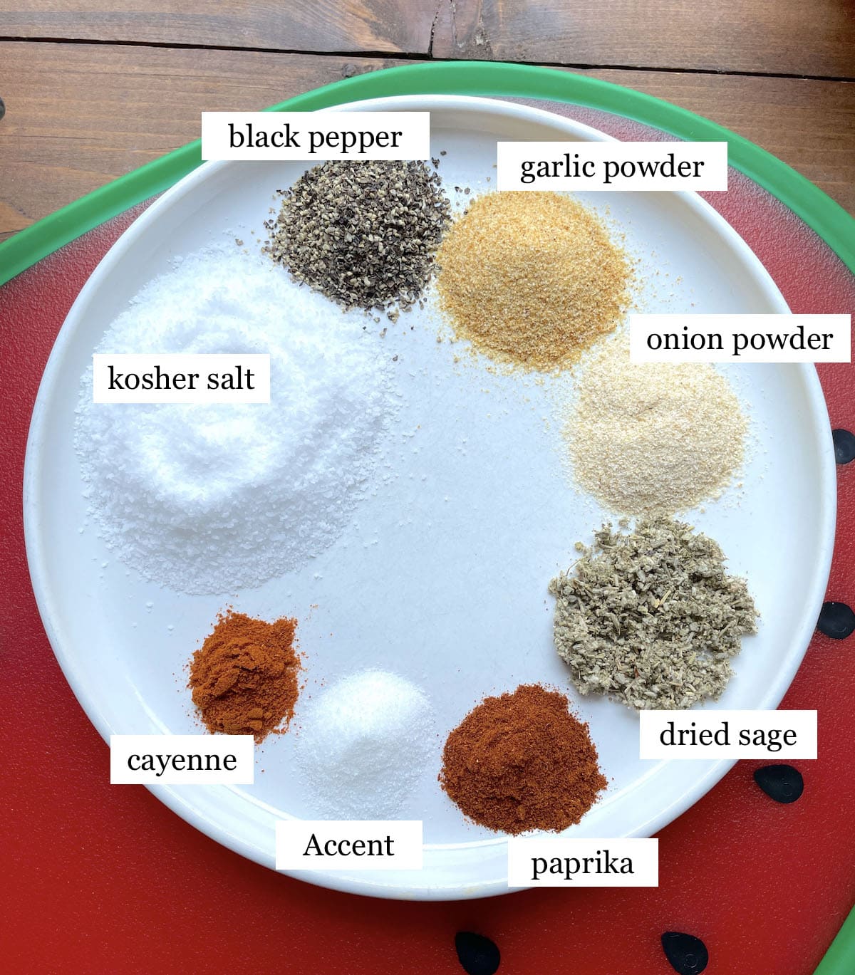 A white plate with the labeled ingredients in Cajun Sparkle fry seasoning on it.