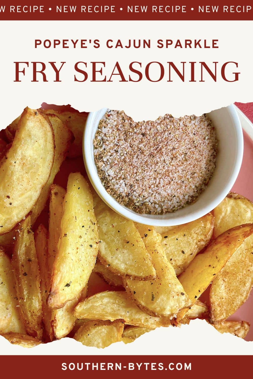 A pin image of a bowl of Cajun Sparkle fry seasoning next to Cajun seasoned potato wedges on a pink plate.