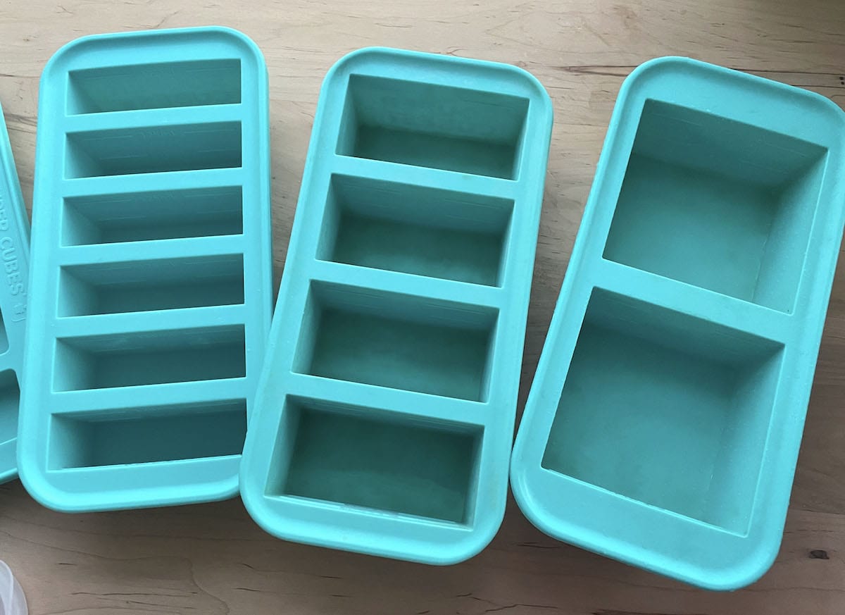 Three different sizes of empty souper cube containers.