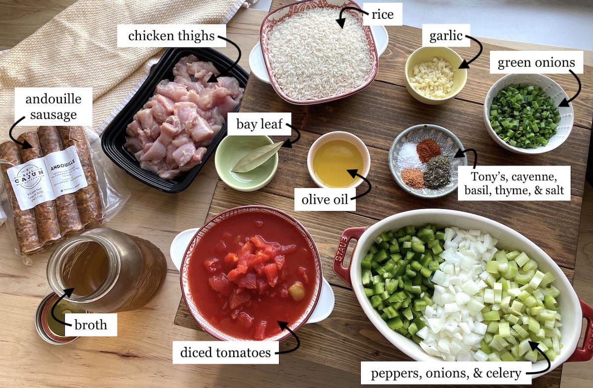 The ingredients in instant pot jambalaya laid out in small bowls and labeled.