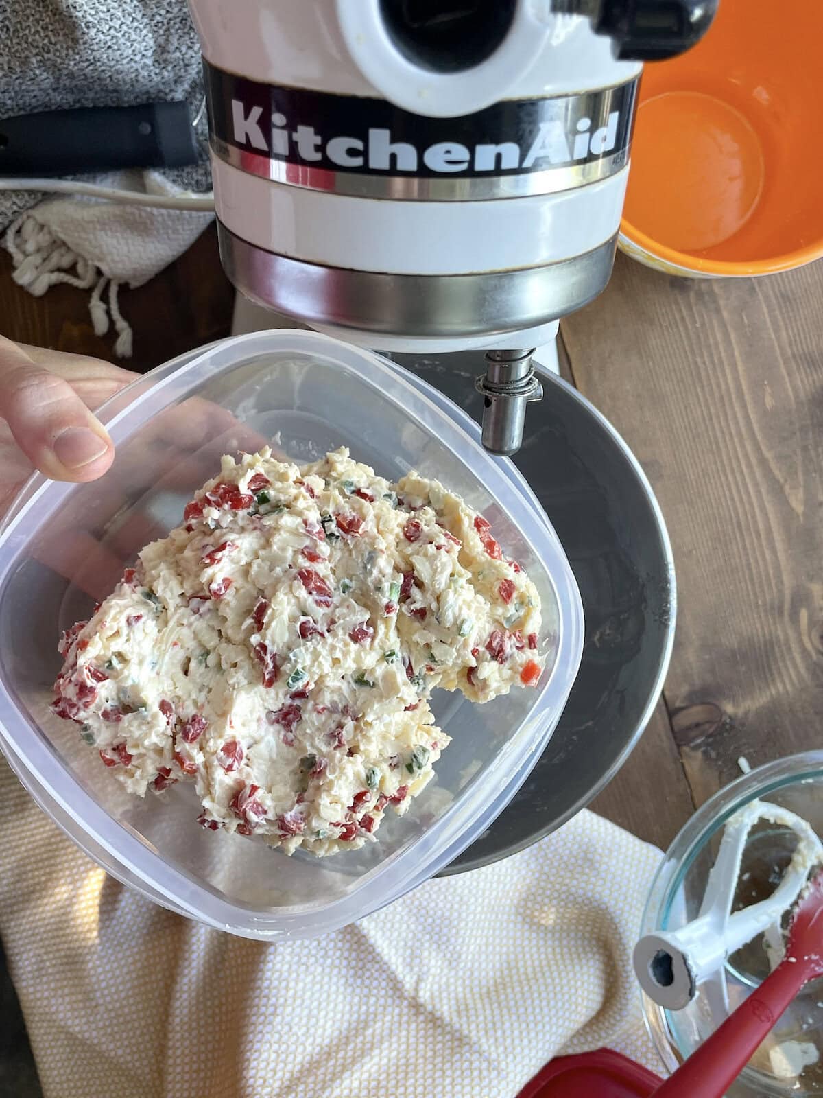 A Tupperware of copycat queen charlotte pimento cheese.
