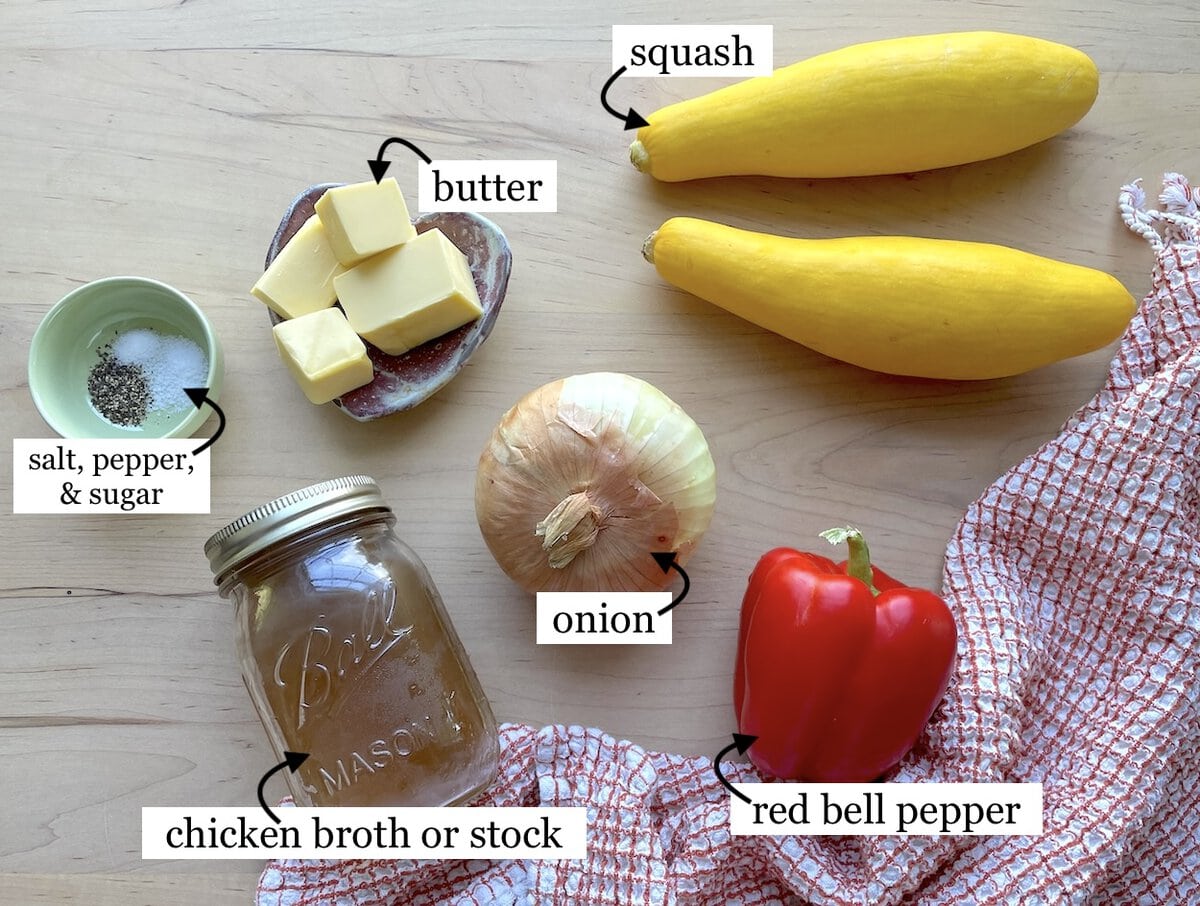 The ingredients in buttery yellow squash with onions, laid out & labeled.