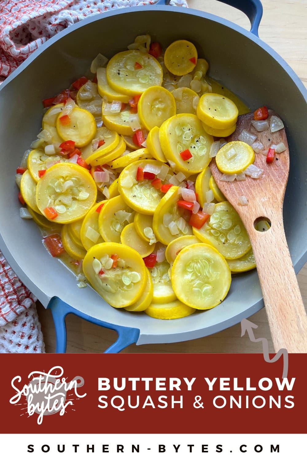 A pin image of a blue and gray frying pan with buttery yellow squash, red bell peppers, and onions in it with a wooden spoon.