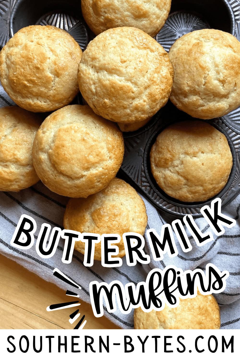 A pin image of a batch of freshly baked buttermilk muffins presented on a dark muffin tin.