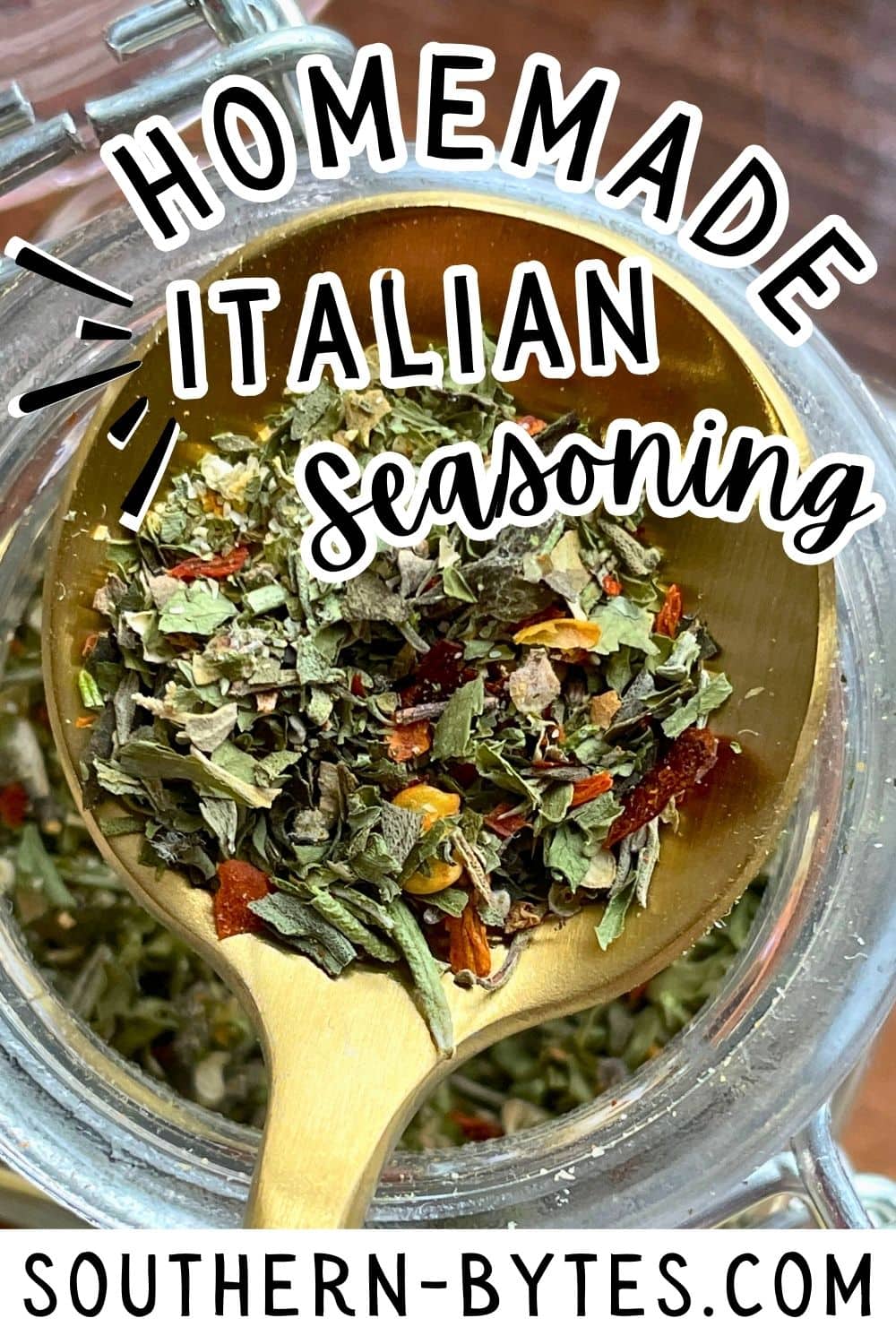 A pin image of a jar of mixed herbs for homemade Italian seasoning with a wooden spoon on a kitchen table.