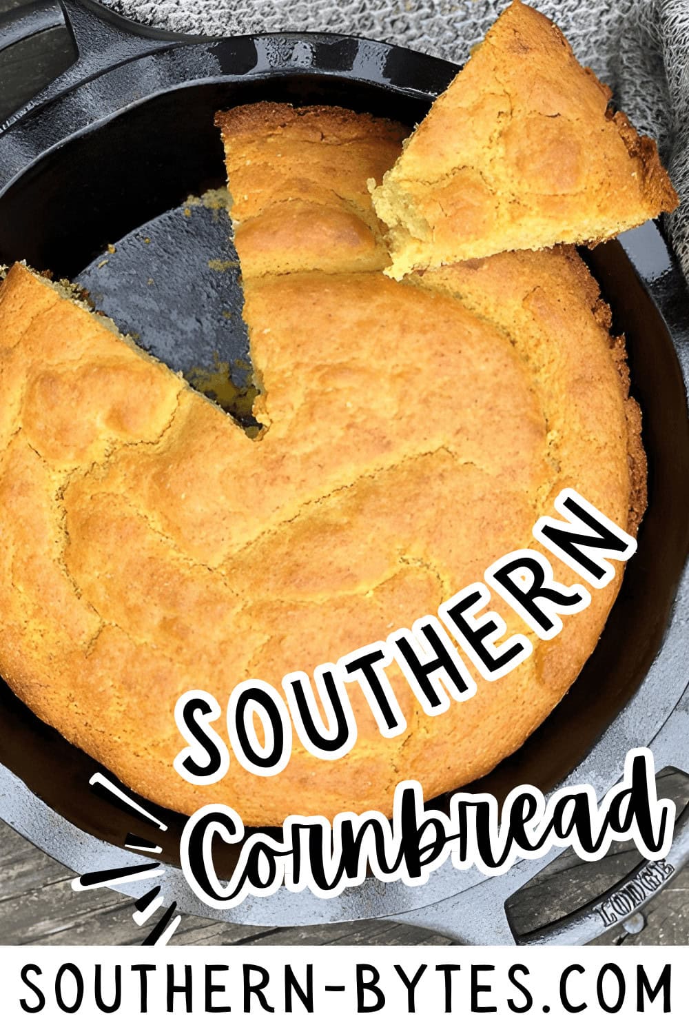 A pin image of freshly baked southern cornbread with a piece cut out, inside a cast-iron skillet.