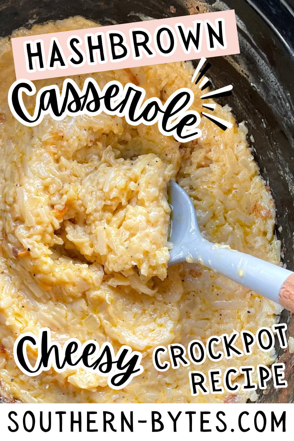 A pin image of a close-up view of a cheesy hashbrown casserole in a crockpot with a spoon.