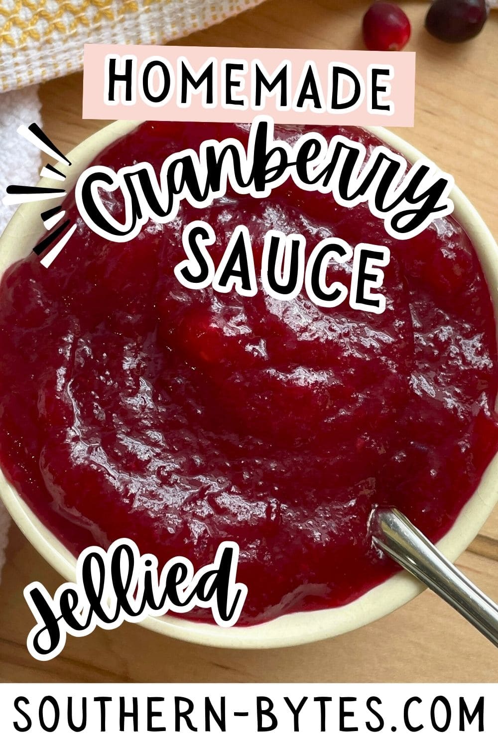 A pin image of a bowl of homemade jellied cranberry sauce with text overlay for a recipe website.