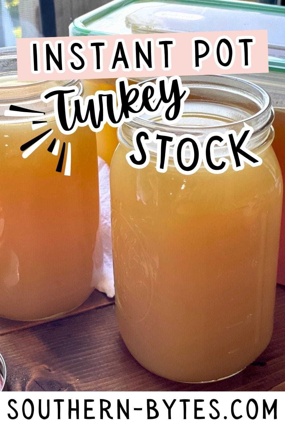 A pin image of glass jars filled with freshly made instant pot turkey stock on a wooden surface.