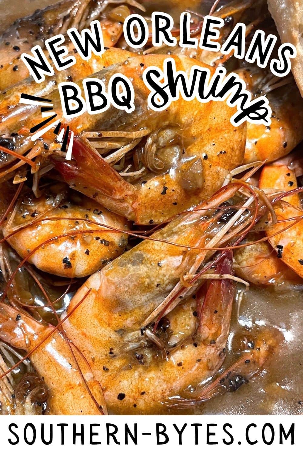 A pin image of a close-up of New Orleans style BBQ shrimp.