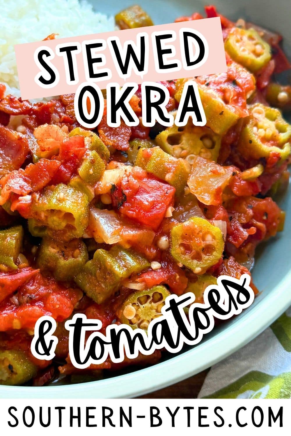 A close-up view of a colorful dish featuring stewed okra and tomatoes, showcasing vibrant greens and reds alongside a serving of white rice.