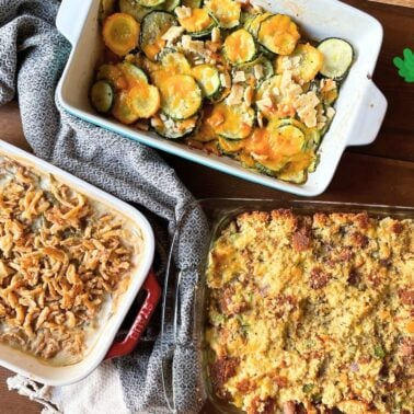 A colorful display of three homemade casseroles, including green bean, cheesy zucchini, and cornbread stuffing, styled with festive bunny and carrot graphics.